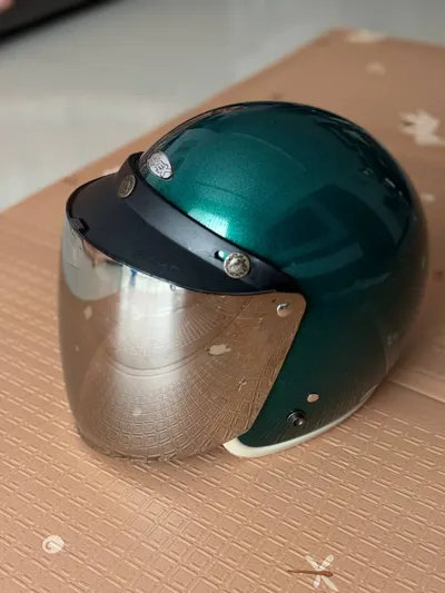 Green Kids Motorcycle Helmet with Mirrored Visor – 300,000 VND