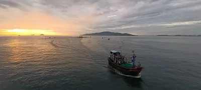 Central Beach at Sunrise – Fishing Boats Returning