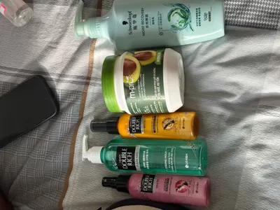 Multiple secondhand items for sale (sneakers, dress, hair conditioner, etc.)