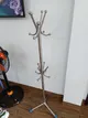Household items for sale: metal coat rack, raincoats, extension cord, frying pan (4 items)