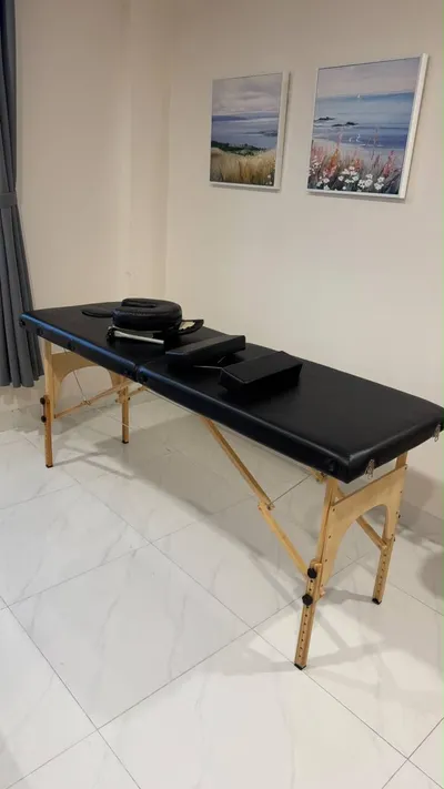 Used household items for sale: massage table, lamp, raincoats, helmets, vacuum, steamer