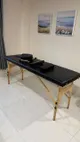 Used household items for sale: massage table, lamp, raincoats, helmets, vacuum, steamer