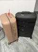 Two suitcases for sale (black in good condition, cream with broken handle)