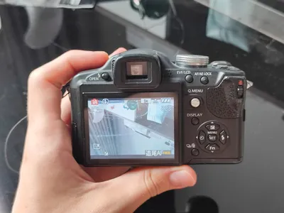 Two used cameras for sale: Panasonic Lumix and Canon PowerShot