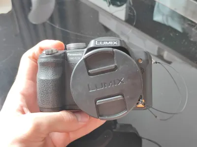 Two used cameras for sale: Panasonic Lumix and Canon PowerShot — 4/5