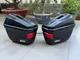 Two GIVI side motorcycle luggage cases with mounts