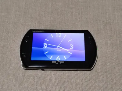 Multi-item sale: PSP GO, manga box set, two cameras