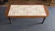 Wooden oval coffee table with folding legs