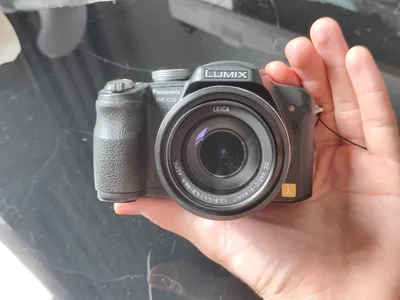 Two used cameras for sale: Panasonic Lumix and Canon PowerShot — 2/5